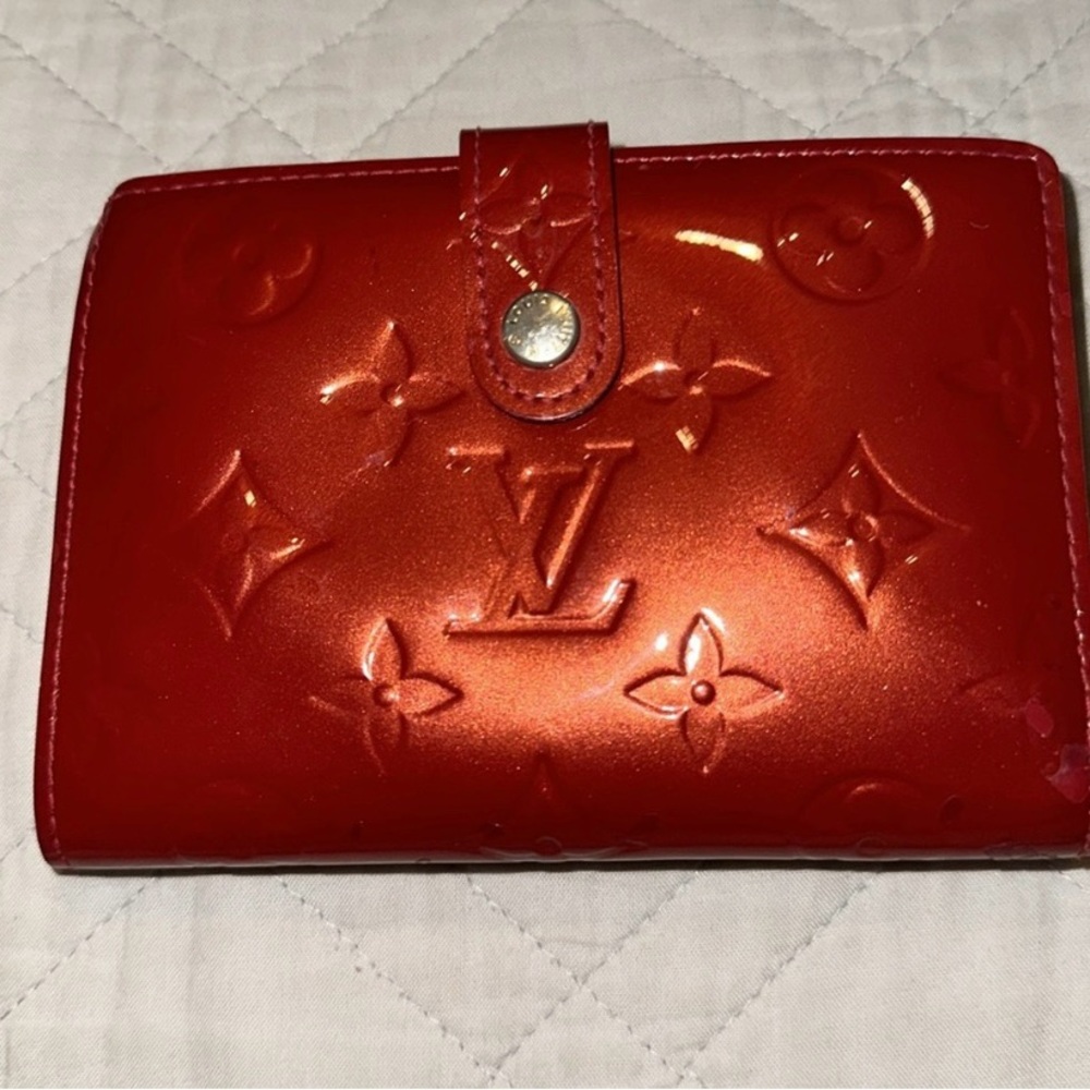 Just in time for Christine. Authentic Louis Vuitton Red Vernis Kisslock wallet.